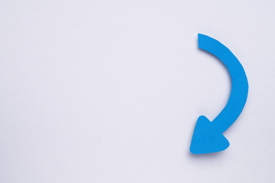 Paper Curved Arrow on White Background, Top View. Space for Text